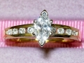 14K Yellow Gold Marquise Cut Center Diamond with Channel Set Side Diamonds
